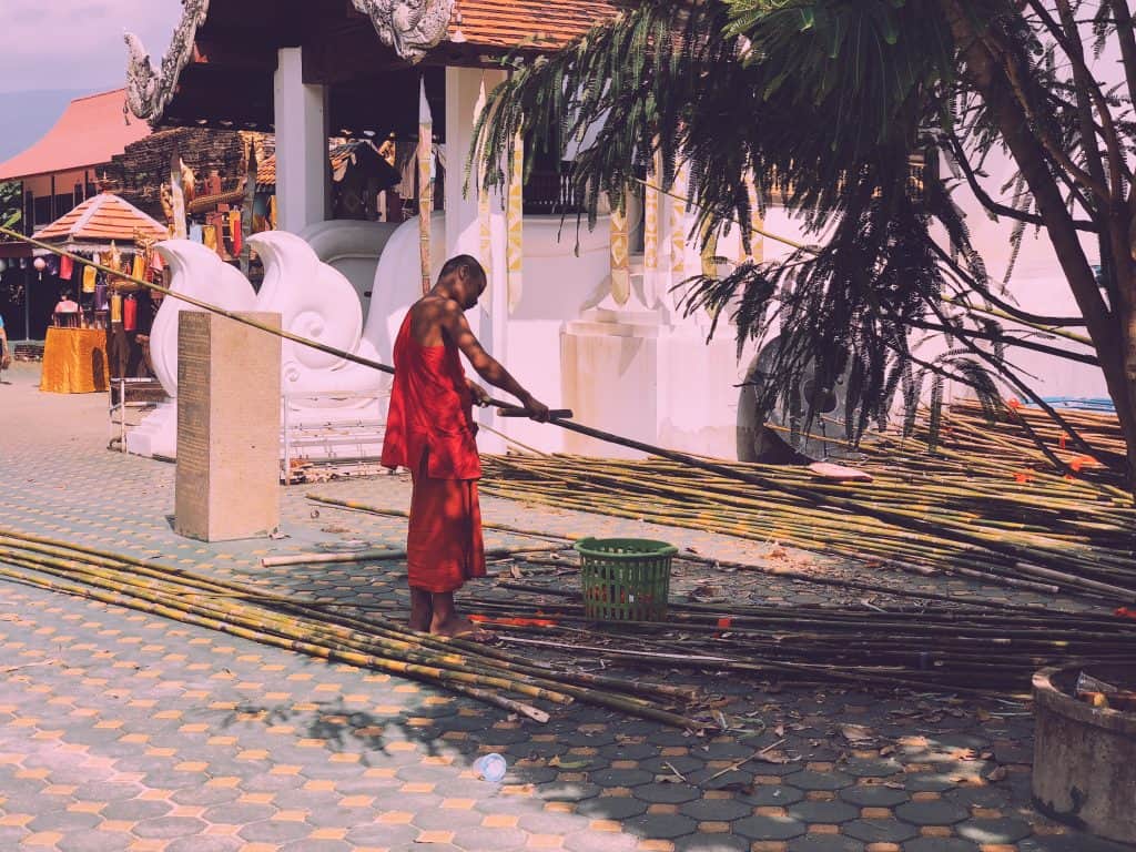 Buddhist monk in Chiang Mai working with bamboo